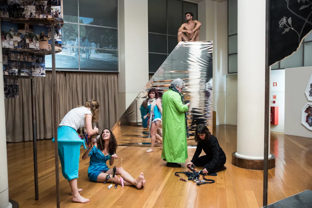 Last iteration of the project consisted of all the characters interacting with each other in a scene reminiscent of a market. All the characters circulated around the space, approaching each other to sell and buy souls. Throughout the performance, several characters also left “souls” on the Altar as offerings to Tuti Momo. One character - “Pensamento Zero” picked up one offering and began to bite it, chew it, and spit it out.